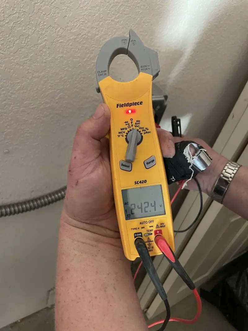 Voltage testing with clamp meter during Electrical Installation Services in Pine Hills